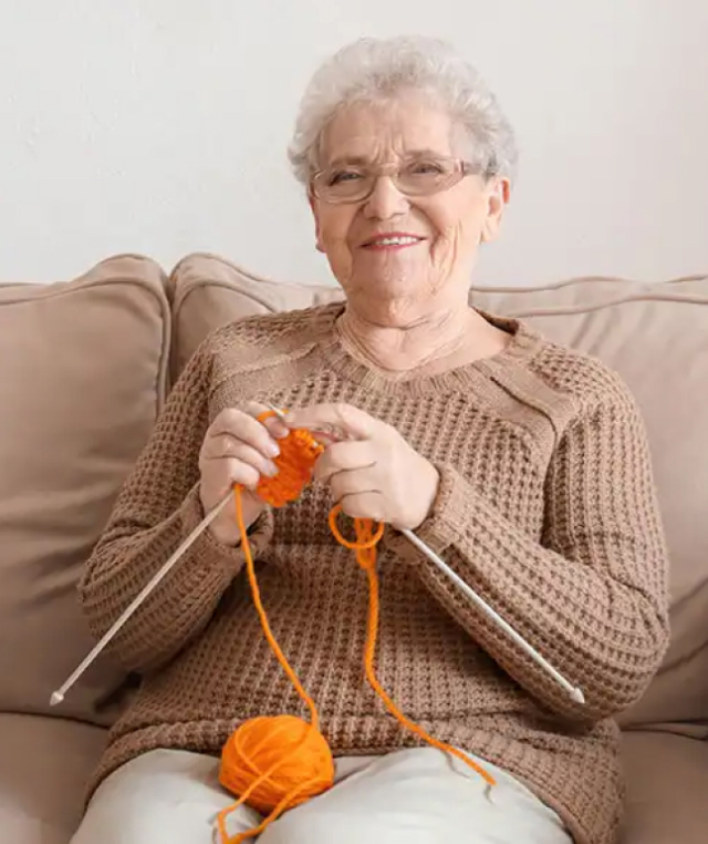 women sitting and knitting